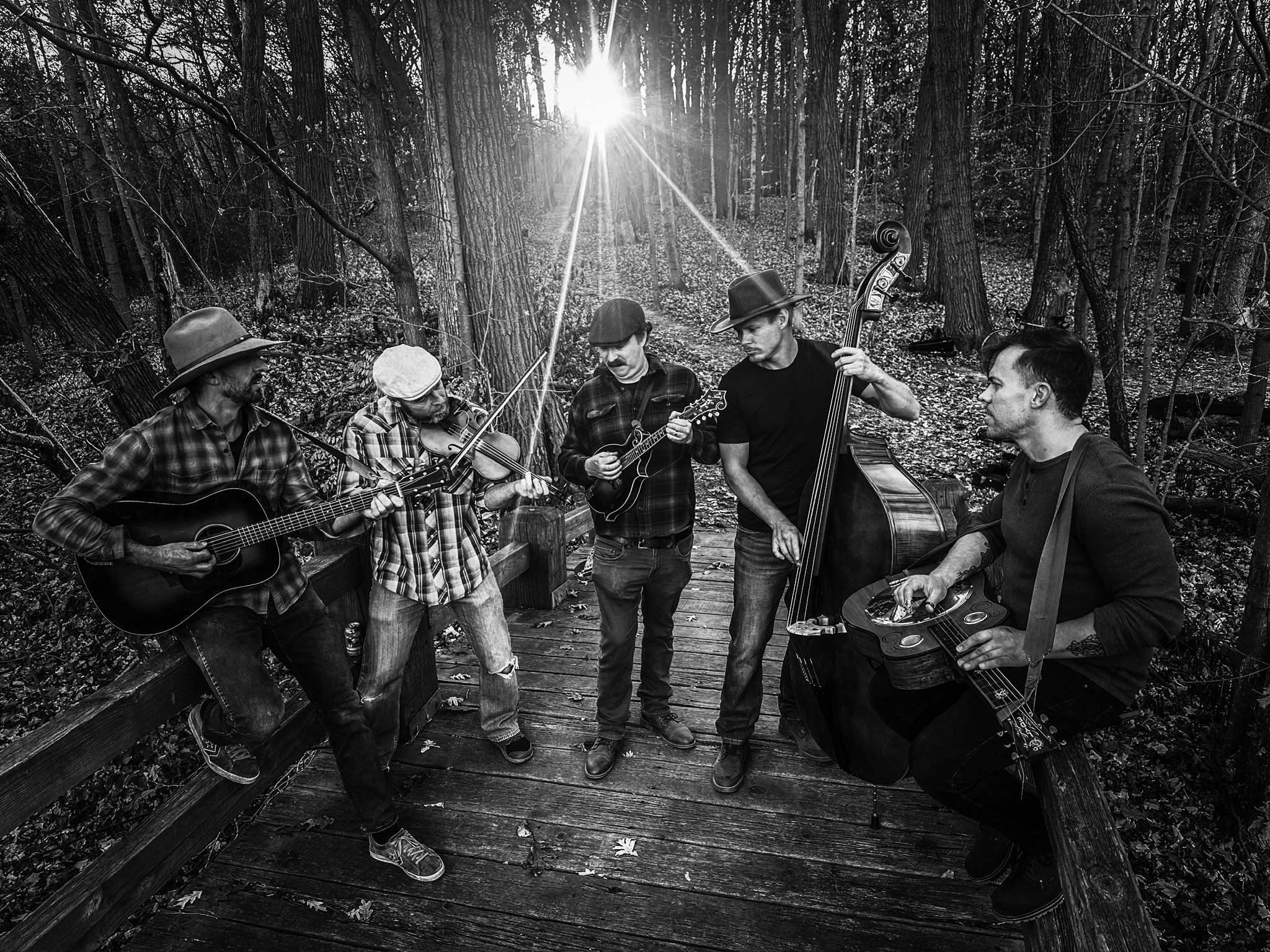 A rock band performing on stage at a concert.